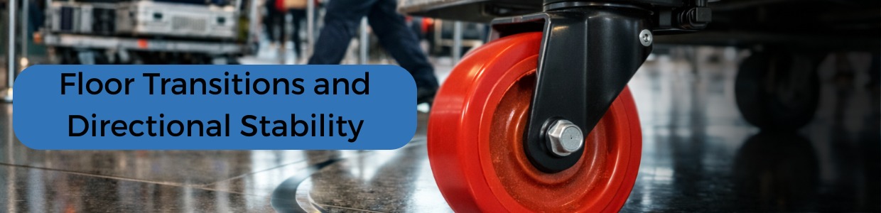 Heavy-duty red industrial castor wheel on a platform trolley moving across a polished warehouse floor, demonstrating smooth floor transitions and directional stability | Rexello Castors