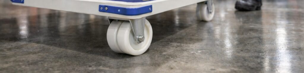 White polyurethane castor wheels mounted on platform trolley for smooth floor mobility | Rexello Castors